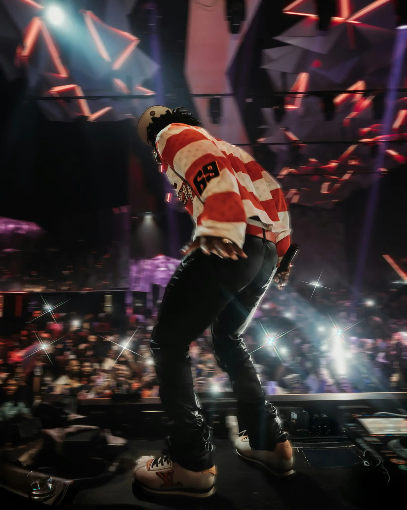 Performer onstage before an invited audience